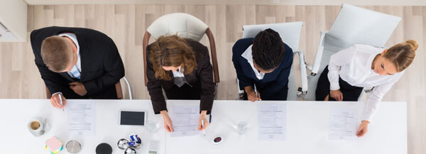 Group of people carrying out job evaluation